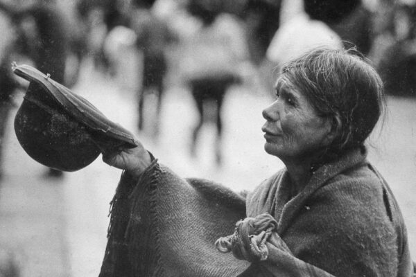 Woman begging in Lima Peru.